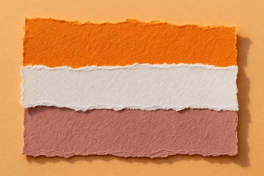 Torn Paper Strips in Orange, White, and Pink Layers on Soft Background photo