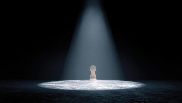 A light shines on a keyhole in a dark room photo