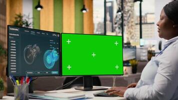 Researcher analyzes turbine parts on chroma key PC to maximize sustainability. CAD designer uses simulation program on isolated screen computer to boost turbine clean energy output, camera B video