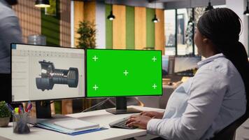 Wind energy researcher analyzes turbine component on green screen PC to maximize sustainability. CAD designer uses software on mockup computer to boost turbine clean energy output, camera A video