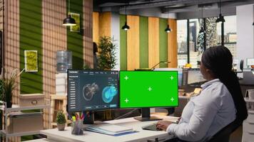 Researcher analyzes turbine parts on chroma key PC to maximize sustainability. CAD designer uses simulation program on isolated screen computer to boost turbine clean energy output, camera A video