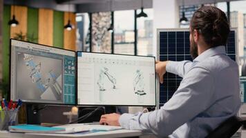 ingenjör i kontor arbetssätt på sol- panel cad design till utveckla teknologi förbättra miljö- prestanda. rd expert- kommande upp med innovativ material för pv sol- celler, kamera b video