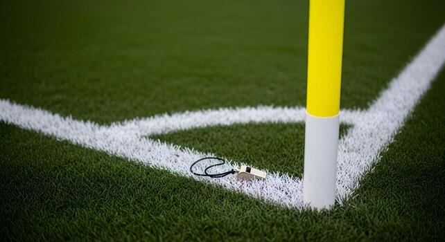 Soccer Training concept with a whistle on a string near a corner flag, featuring sharp textures and crisp edges. Clean composition with copy space, suitable for fitness stories. photo