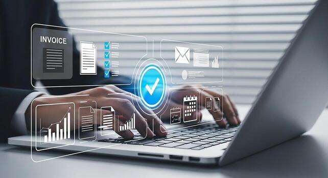 Businessperson using laptop computer to manage invoices and complete tasks in a modern office setting, showcasing efficiency and success photo