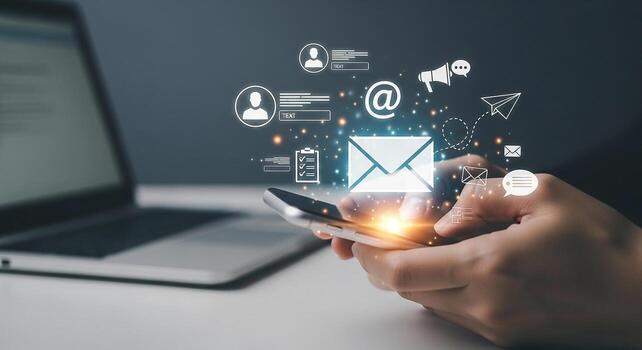 Person using smartphone to check email, manage messages, and engage in digital communication in a modern workspace, symbolizing efficient online connectivity and communication photo