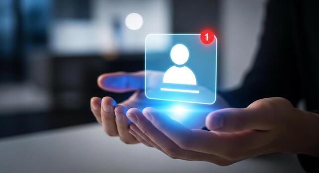 Person holding a glowing digital profile notification in hands, signifying new connection or message in modern office setting Represents networking, communication, and online inter photo