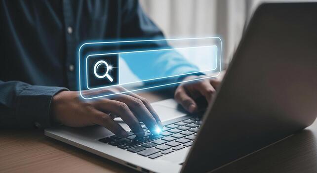 Person using laptop computer to search online, working in modern office, searching for information and solutions, concept of digital technology and innovation photo