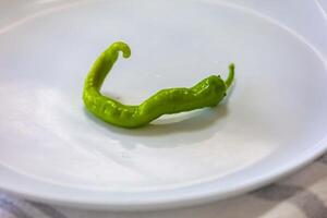 shishito pimienta Pimiento annuum mar japonés, o japonés dulce pimienta, no picante y muy sabroso sasa foto