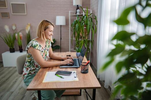 Creating a cozy workspace with plants and positivity photo