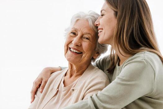 Joyful moment shared between a grandmother and granddaughter in a bright, cozy setting during the afternoon photo