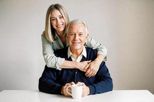 Couple enjoys a cozy moment together at home with warm smiles and a cup of coffee in a modern setting photo
