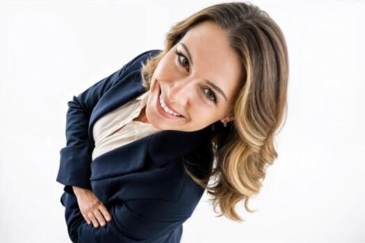 Professional woman smiling confidently in a studio setting with bright background photo
