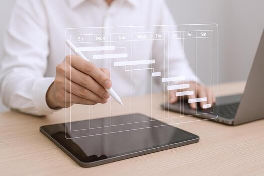 Project Management Planning Man Using Tablet and Pen for Schedule and Task Management photo