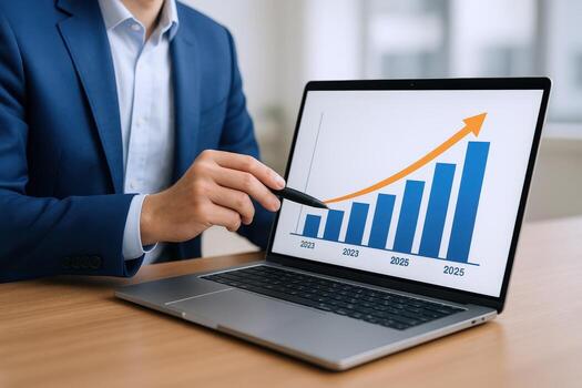 Business Professional Analyzing Growth Chart on Laptop Display, Pointing with Pen, Indicating Positive Financial Performance photo