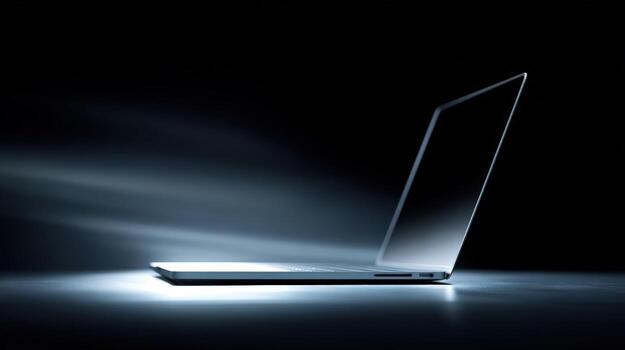 Sleek Silver Laptop on Dark Backdrop Displaying Modern Technology and Design for Professional or Personal Use photo