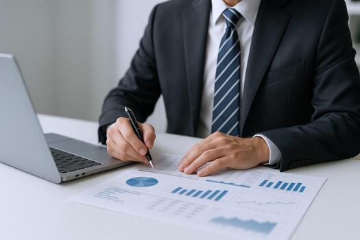 Business Professional Analyzing Financial Data and Signing Documents in Modern Office Setting, Focused on Growth and Strategy photo