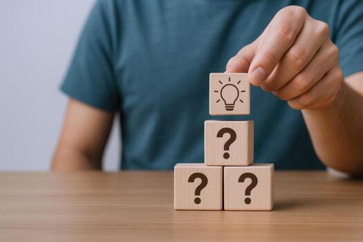 Idea Generation Concept Person Stacking Wooden Blocks with Lightbulb Icon on Question Marks for Creative Problem-Solving photo