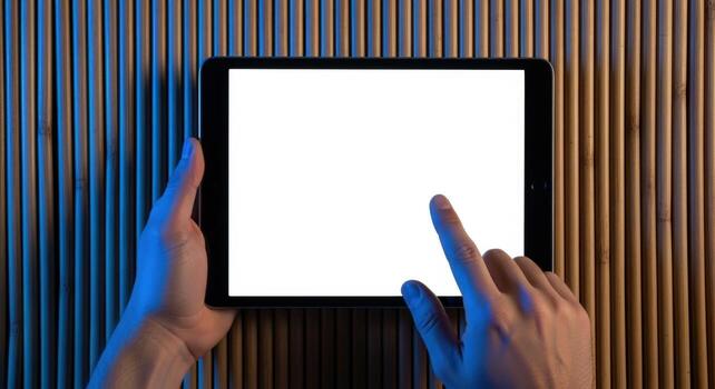 Hands Using Tablet with Blank White Screen for Mockup Presentation Against Textured Background photo