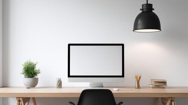Modern Minimalist Workspace Mockup with Blank Computer Screen, Desk Plant, Lamp, and Books for Business photo