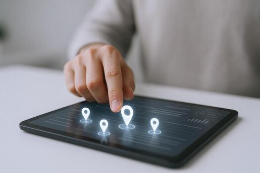 Hand Interacting with Digital Map on Tablet, Highlighting Location Pins for Navigation and Business photo