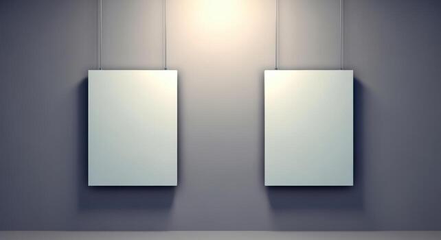Two Blank White Frames Hanging on Gray Wall, Illuminated by Spotlights, Ideal for Art Display photo