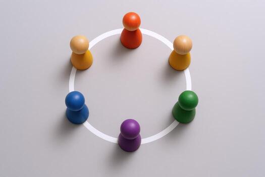Teamwork Concept Colorful Wooden Figures Arranged in a Circle, Symbolizing Collaboration and Unity on Gray Background photo