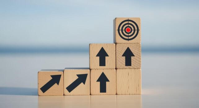 Wooden Blocks Stacked with Arrows Pointing Upwards, Leading to Target, Representing Growth and Achievement photo