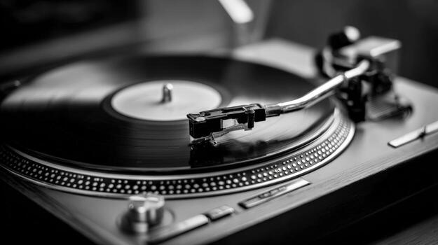 Monochrome Close-Up of a Vinyl Record Player with a Record, Emphasizing Retro Music and Classic Sound photo