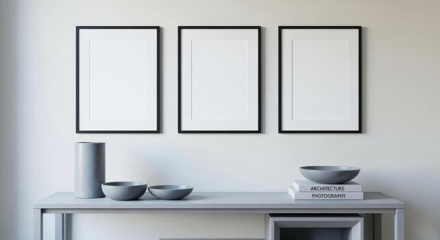 Minimalist Interior with Three Black Framed Mockups Above a Console Table, Perfect for Art Display photo