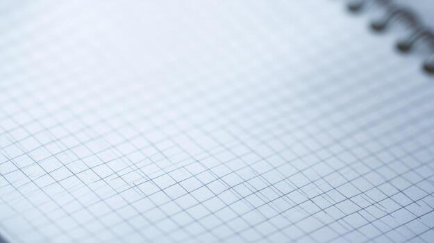 Close-up of Graph Paper with Spiral Binding, Ideal for Backgrounds, Textures, and Design Overlays photo