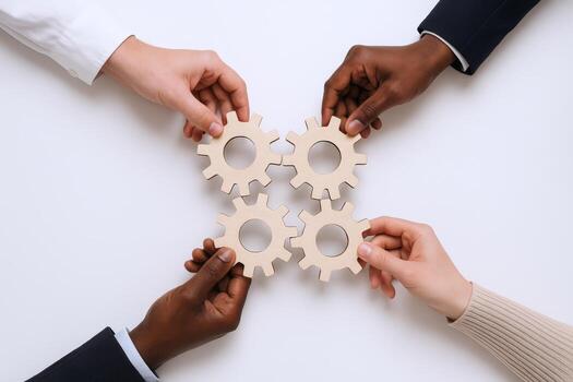 Diverse Team Collaboration Hands Assembling Interlocking Gears to Symbolize Unity and Successful Problem-Solving on White Background photo