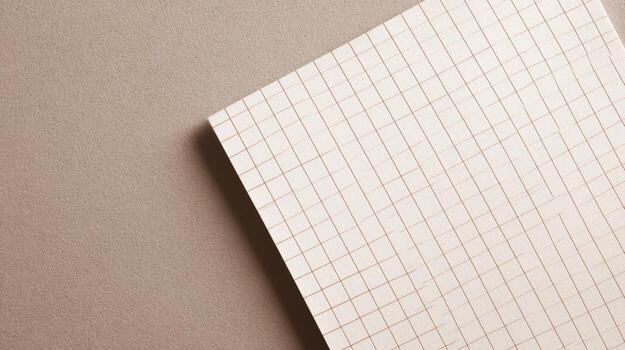 Graph Paper Sheet Close-Up on Textured Surface, Ideal for Mockups and Creative Designs photo