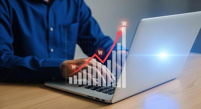 Online Sales Growth Visualization Person Typing on Laptop with Increasing Chart Overlay for eCommerce photo