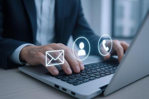 Contact Options Conceptual Image Featuring Person Typing on Laptop Keyboard with Contact Icons photo