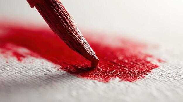 Close-up of Red Paint Brush Applying Pigment to Canvas, Showcasing Artistic Expression and Creative Process photo