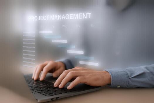 Project Management Software Interface on Laptop Display Showing Gantt Chart and Hands Typing for Business Planning photo