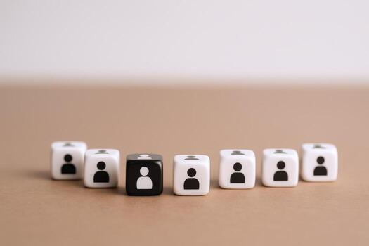 Diversity and Inclusion Concept Dice with Silhouette Icons Representing Teamwork and Human Resources photo