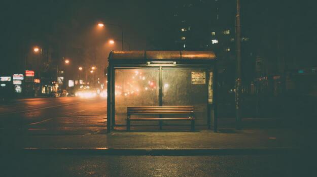 Atmospheric Urban Bus Stop at Night Empty Bench and City Lights in the Darkness photo