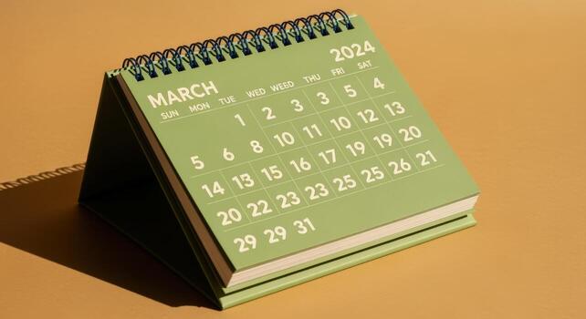 March 2024 Desk Calendar Displaying Dates on Beige Surface, Perfect for Business and Planning Concepts photo