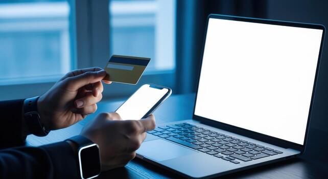 Online Shopping with Mobile and Credit Card Secure Payment on Laptop photo