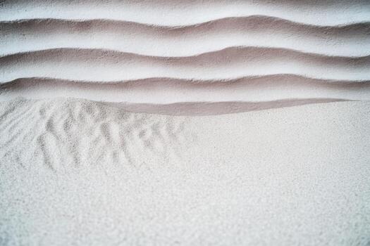 Patterns of sand create a tranquil landscape at the beach during sunrise photo