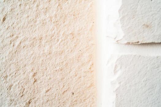Close-up view of textured wall showing paint variation and surface detail photo