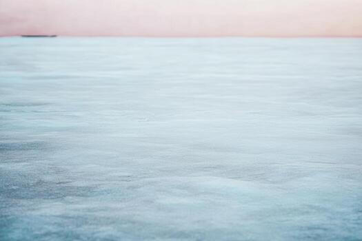 Calm icy landscape at dusk with soft color gradient in the sky photo