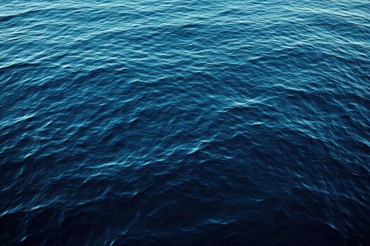 Deep blue ocean waves creating a tranquil atmosphere at sunset photo