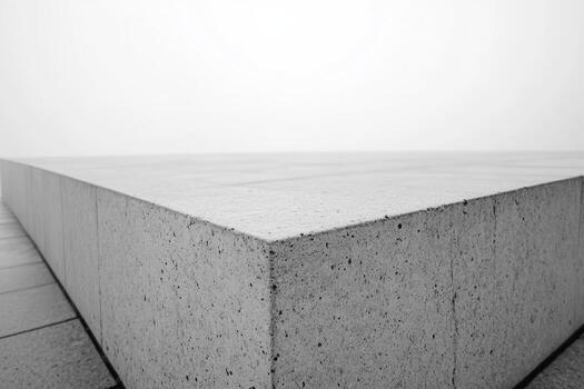 Monochromatic concrete structure with sharp angles in misty environment photo