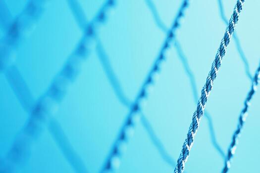 Close-up view of blue ropes creating a textured pattern against the sky photo