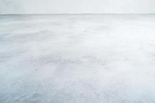 Smooth gray concrete floor with subtle textures and patterns in natural light photo