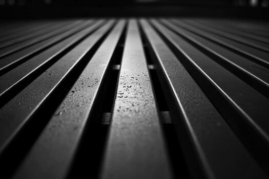 Textured black surface with droplets captured in low light conditions photo