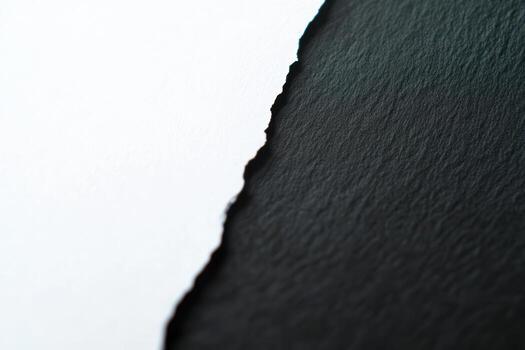 Torn paper edges revealing contrasting textures and colors in artistic display photo