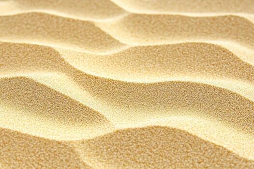 Textured golden sand with undulating patterns under soft light photo
